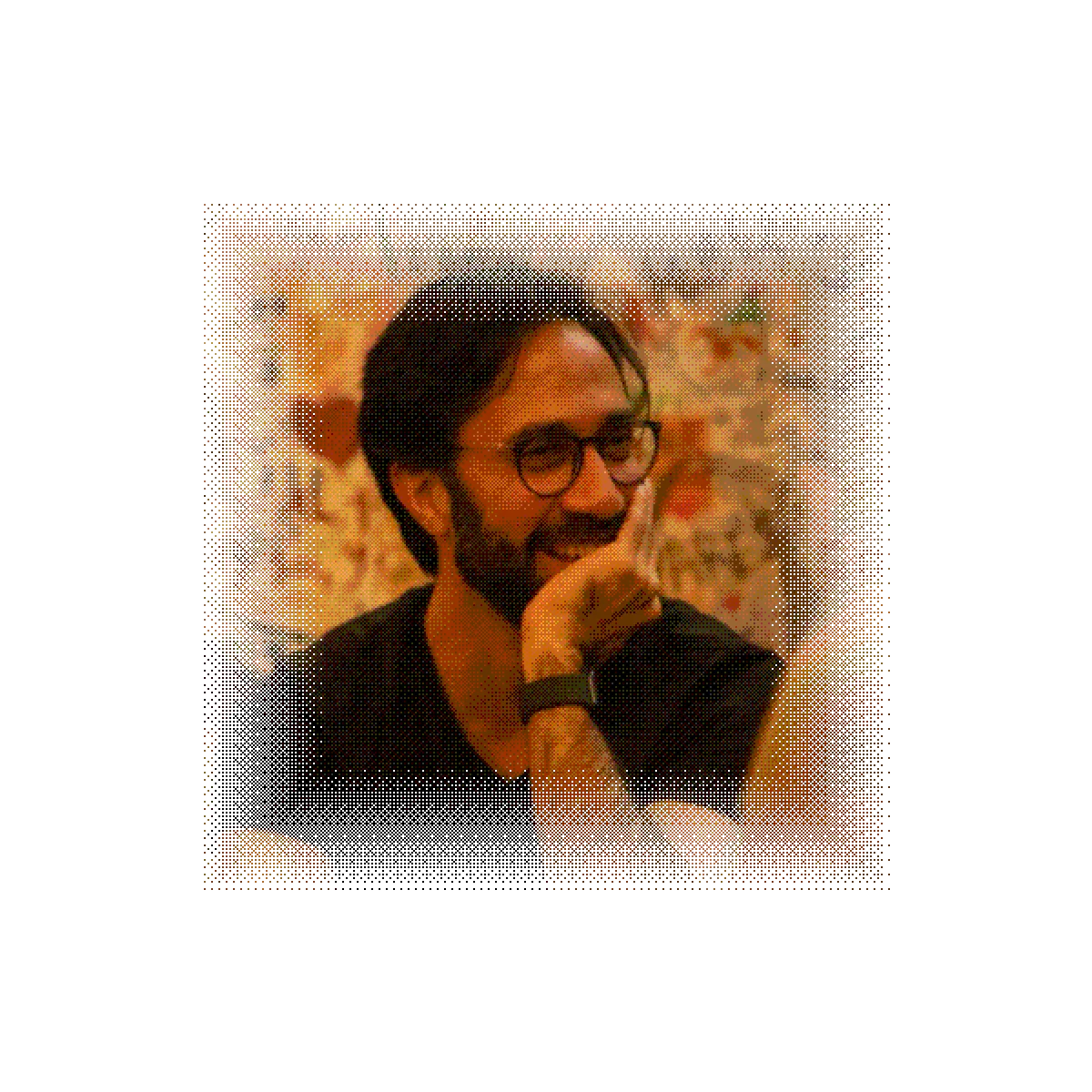 Vikram laughing mid-conversation, rendered as a warm halftone print